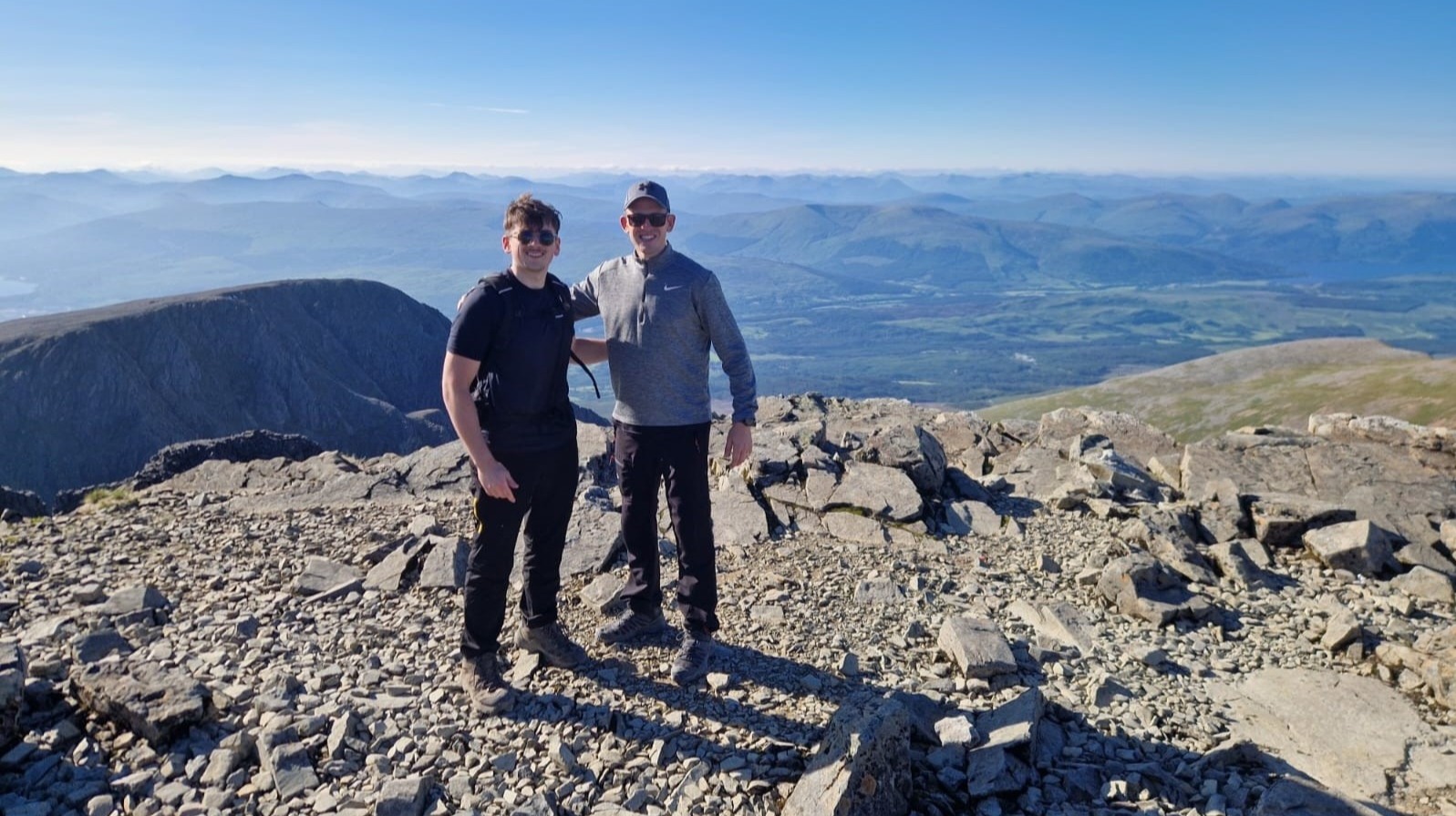 Rail team members at the top of Ben Nevis during their three peaks challenge for charity in 2024