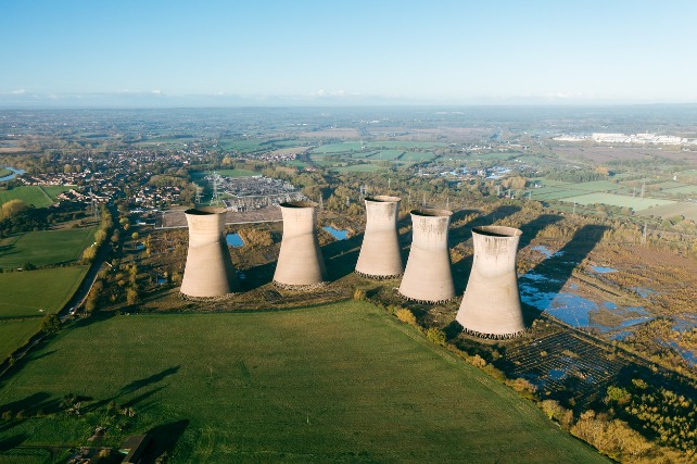 A nuclear plant with 5 funnels in a large field in England