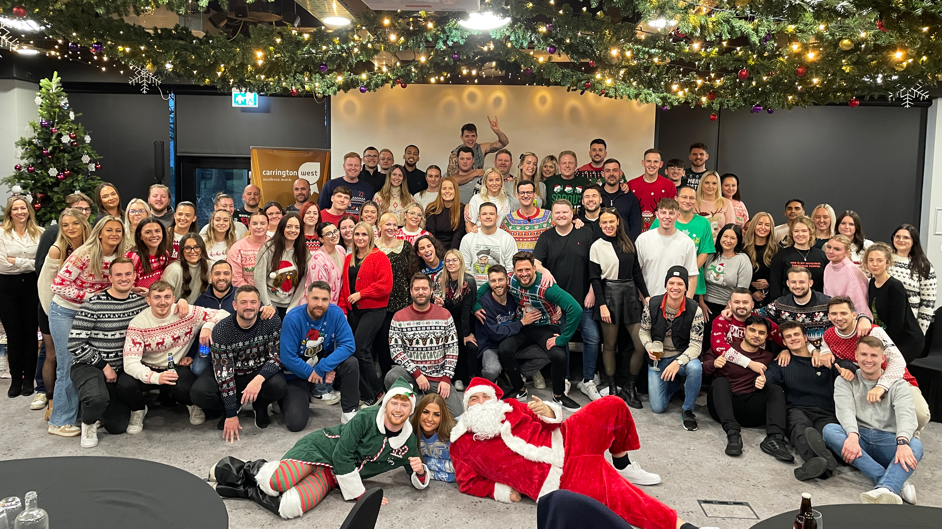 Carrington West Team celebrating at our End of Year company update