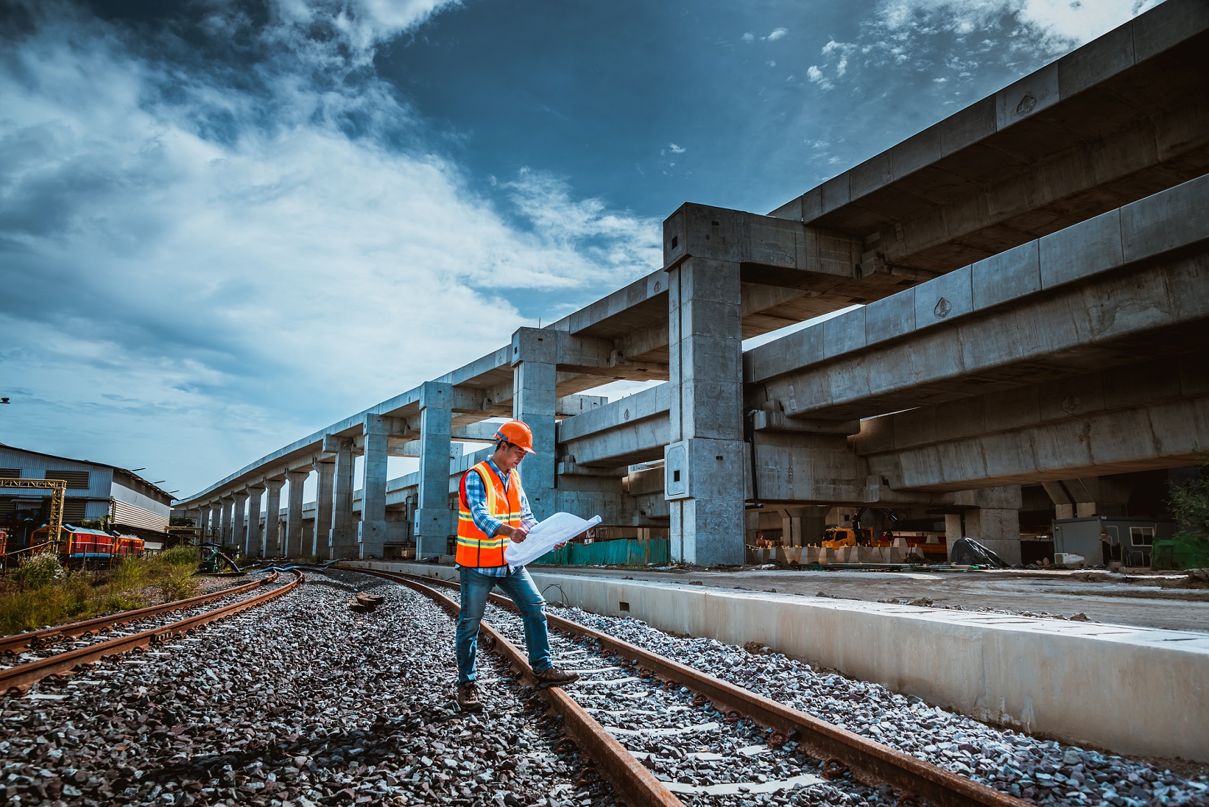 A view of railway engineers on a railway by the side of a station