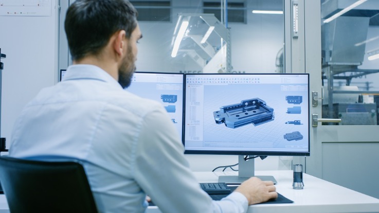 Revit technician working on complex 3D modelling on the computer