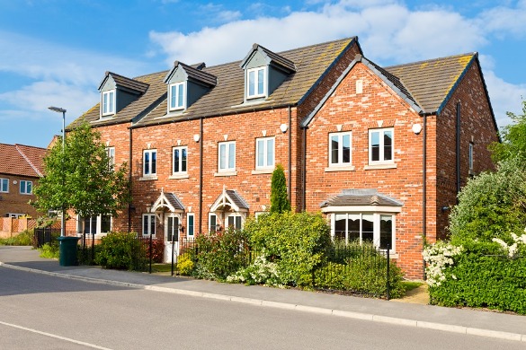 Row of modern brick houses on a small suburban street